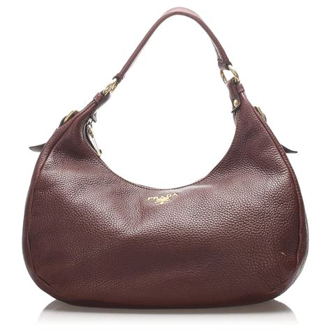 dark brown leather hobo purse.